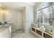 Bathroom with tile flooring, custom sink and vanity, and natural light from a large window at 832 Forest Path Ln, Alpharetta, GA 30022