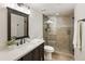 Modern bathroom with a glass shower and a vanity at 832 Forest Path Ln, Alpharetta, GA 30022