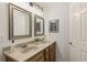Bright bathroom featuring dual sinks, and decorative mirrors at 832 Forest Path Ln, Alpharetta, GA 30022