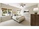 Bright bedroom with windows, a ceiling fan, and a painting on the wall at 832 Forest Path Ln, Alpharetta, GA 30022