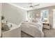Well-lit bedroom with neutral walls, bedside lamps, and stylish decor on the bedside tables at 832 Forest Path Ln, Alpharetta, GA 30022