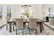 Elegant dining room with a modern chandelier, large table, and comfortable seating for Gathering gatherings at 832 Forest Path Ln, Alpharetta, GA 30022
