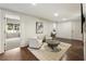 Elegant living room with hardwood floors, recessed lighting, and comfortable seating at 832 Forest Path Ln, Alpharetta, GA 30022