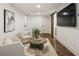 Living room with a large screen television and comfortable seating at 832 Forest Path Ln, Alpharetta, GA 30022