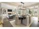 Open floor plan with dining area flowing into the living room with fireplace and built-ins at 832 Forest Path Ln, Alpharetta, GA 30022