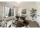 Bright home office with hardwood floors, a large window, and a modern work space at 832 Forest Path Ln, Alpharetta, GA 30022