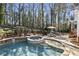 Backyard pool with jacuzzi and patio at 832 Forest Path Ln, Alpharetta, GA 30022