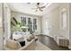 Bright sunroom with vaulted ceiling, skylight, ceiling fan, and windows offering natural light at 832 Forest Path Ln, Alpharetta, GA 30022