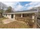 Backyard featuring a patio, a white brick house, and a wood fence at 1385 Lucky Sw Ln, Mableton, GA 30126