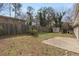 Spacious backyard with a white brick house, shed, and a wood privacy fence at 1385 Lucky Sw Ln, Mableton, GA 30126