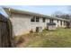 Backyard with white brick house, an air conditioner, and a wood privacy fence at 1385 Lucky Sw Ln, Mableton, GA 30126