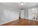 Bedroom featuring hardwood floors, neutral paint, and access to ensuite bathroom at 1385 Lucky Sw Ln, Mableton, GA 30126