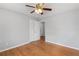 Spacious bedroom with hardwood floors, neutral paint, ceiling fan, and closet at 1385 Lucky Sw Ln, Mableton, GA 30126