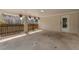 Covered carport with a gated fence and a door leading to the backyard at 1385 Lucky Sw Ln, Mableton, GA 30126