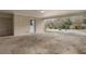 Spacious carport with a door leading to the backyard and mature trees at 1385 Lucky Sw Ln, Mableton, GA 30126