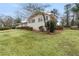 A charming single-story brick home with lush lawn and manicured shrubbery at 1385 Lucky Sw Ln, Mableton, GA 30126