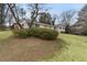 Single-story brick home with mature trees and established landscaping at 1385 Lucky Sw Ln, Mableton, GA 30126