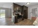 Updated kitchen features stainless steel appliances, dark cabinets, and stylish countertops at 1385 Lucky Sw Ln, Mableton, GA 30126