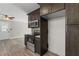 Updated kitchen features stainless steel appliances, dark cabinets, and stylish countertops at 1385 Lucky Sw Ln, Mableton, GA 30126
