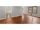 Open-concept space with hardwood floors connecting the living and dining areas at 1385 Lucky Sw Ln, Mableton, GA 30126