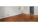 A bright and spacious living area featuring hardwood floors and neutral paint at 1385 Lucky Sw Ln, Mableton, GA 30126