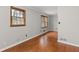 Living room featuring wood-framed windows, hardwood flooring, and neutral paint at 1385 Lucky Sw Ln, Mableton, GA 30126