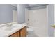 Cozy bathroom featuring a shower-tub combo and vanity storage at 2010 Skylar Leigh Dr, Buford, GA 30518