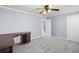 Spacious bedroom offers wall-to-wall carpeting, ceiling fan, and two entry doors at 2010 Skylar Leigh Dr, Buford, GA 30518
