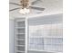 Bright bedroom features blinds on windows, ceiling fan, and white-painted trim at 2010 Skylar Leigh Dr, Buford, GA 30518