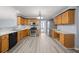 Eat-in kitchen features wood cabinets, stainless appliances, laminate floors, and lots of counter space at 2010 Skylar Leigh Dr, Buford, GA 30518