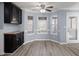 Bright breakfast area with hardwood floors, a ceiling fan, and a door to the backyard at 2010 Skylar Leigh Dr, Buford, GA 30518