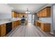 Eat-in kitchen featuring stainless steel appliances, wood cabinets, and laminate floors at 2010 Skylar Leigh Dr, Buford, GA 30518
