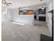 Open floor plan featuring a living room with fireplace flowing into a kitchen area at 2010 Skylar Leigh Dr, Buford, GA 30518
