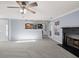 Bright, spacious living room with gray carpet and open view of the kitchen at 2010 Skylar Leigh Dr, Buford, GA 30518