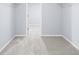 Spacious walk-in closet with soft carpeting and wire shelving for ample storage space at 2010 Skylar Leigh Dr, Buford, GA 30518