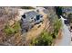 An elevated view of a stylish two-story house with a deck, complemented by verdant trees and landscaping at 2949 Summitop Ne Ct, Marietta, GA 30066