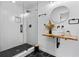 Modern bathroom with walk-in glass shower and a floating wood sink with matte black hardware at 2949 Summitop Ne Ct, Marietta, GA 30066