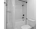 Clean bathroom featuring a shower with white subway tile surround and a toilet with matching white seat at 2949 Summitop Ne Ct, Marietta, GA 30066