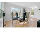 Dining area with a glass table, modern chairs, and a large window with a view at 2949 Summitop Ne Ct, Marietta, GA 30066