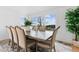 Bright dining room featuring a large window with backyard view, wood table and seating for six at 2949 Summitop Ne Ct, Marietta, GA 30066