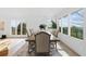 Dining room with large table, views through bright windows, and hardwood floors at 2949 Summitop Ne Ct, Marietta, GA 30066
