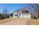 Beautiful two-story white house with a modern design, large windows, and an attached two-car garage at 2949 Summitop Ne Ct, Marietta, GA 30066