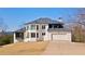 Stunning two-story home with a clean white facade, well-manicured lawn, and attached two-car garage at 2949 Summitop Ne Ct, Marietta, GA 30066