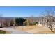 A picturesque street corner with a view of a well-maintained house and a scenic wooded backdrop at 2949 Summitop Ne Ct, Marietta, GA 30066