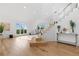 Airy foyer with hardwood floors, glass-railed staircase, and scenic views visible through expansive windows at 2949 Summitop Ne Ct, Marietta, GA 30066