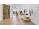 Bright foyer with hardwood floors, custom wood door, open staircase, and scenic backyard views at 2949 Summitop Ne Ct, Marietta, GA 30066