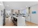 Spacious kitchen featuring an island with marble countertops, stainless steel appliances, and hardwood floors at 2949 Summitop Ne Ct, Marietta, GA 30066
