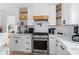 Spacious modern kitchen with an island featuring marble countertops, stainless steel appliances, and hardwood floors at 2949 Summitop Ne Ct, Marietta, GA 30066