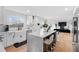 Spacious modern kitchen with an island featuring marble countertops, stainless steel appliances, and hardwood floors at 2949 Summitop Ne Ct, Marietta, GA 30066