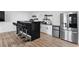 Modern kitchen with stainless steel appliances, bar seating, and open shelving at 2949 Summitop Ne Ct, Marietta, GA 30066